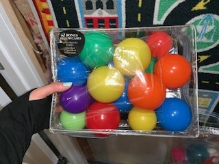 Organizing plastic toy balls in clear case