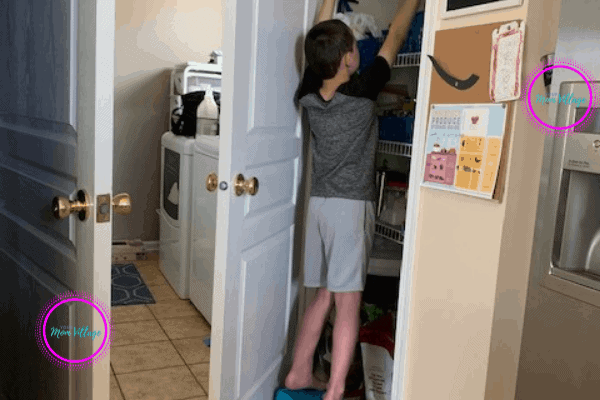 Child getting a snack from the pantry