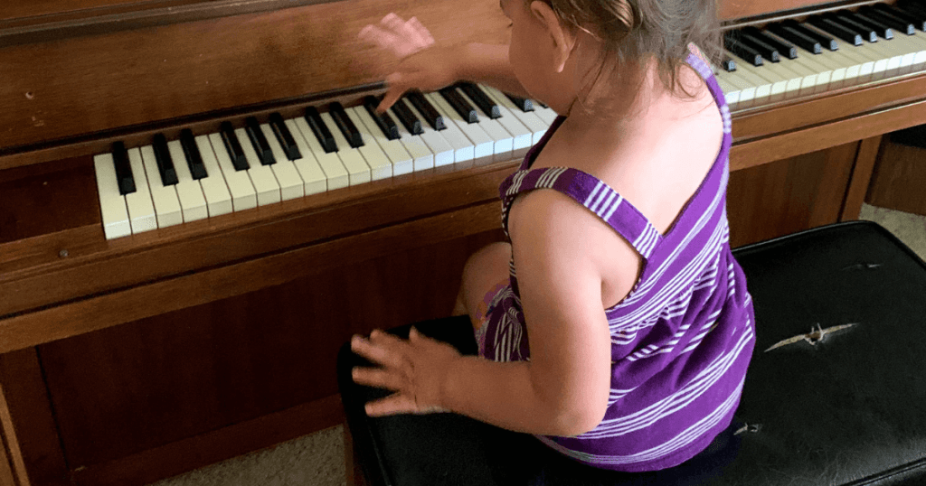 Little girl playing piano
