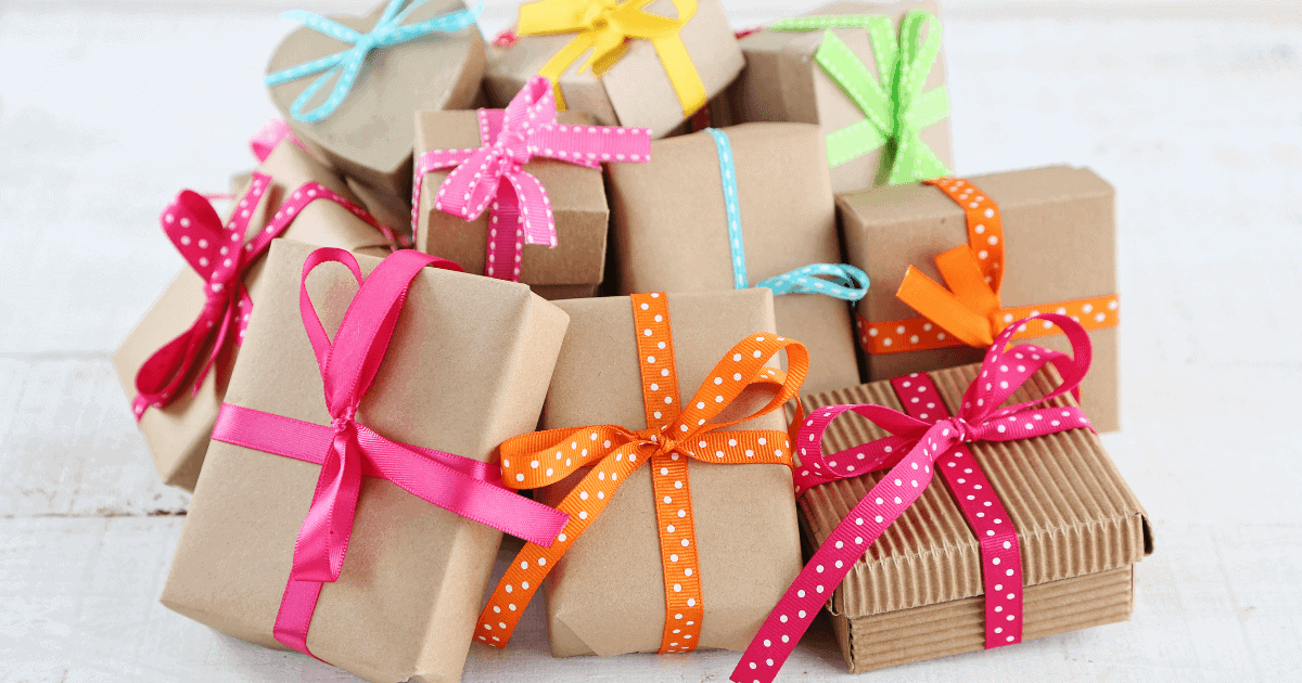 Gifts wrapped in brown paper and colored bows