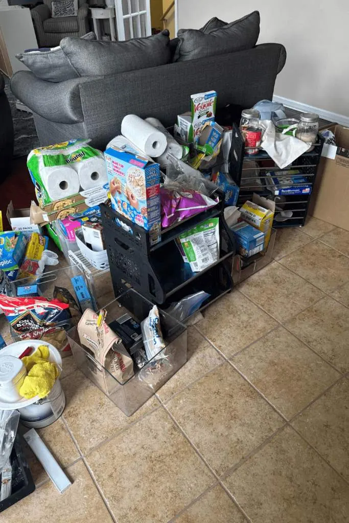 Messy Pantry items behind a couch