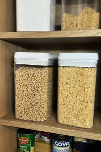Cereal stored in clear containers in pantry